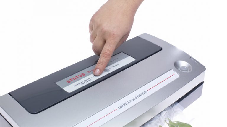 pressing the button on vacuum sealer BV500