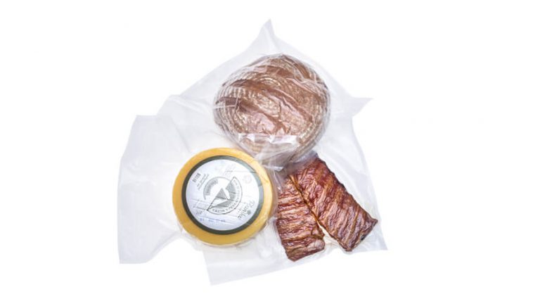 vacuum packed ribs, wheel of cheese and bread